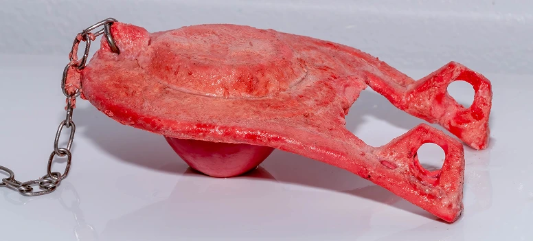 Toilet flapper and chain inside the tank being inspected for leaks or improper sealing